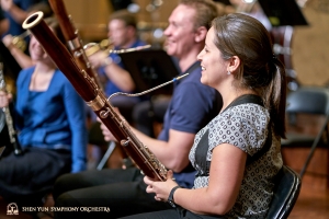 Bassoonists Gabriela Gonzalez and Aleksander Velichko share a laugh. 